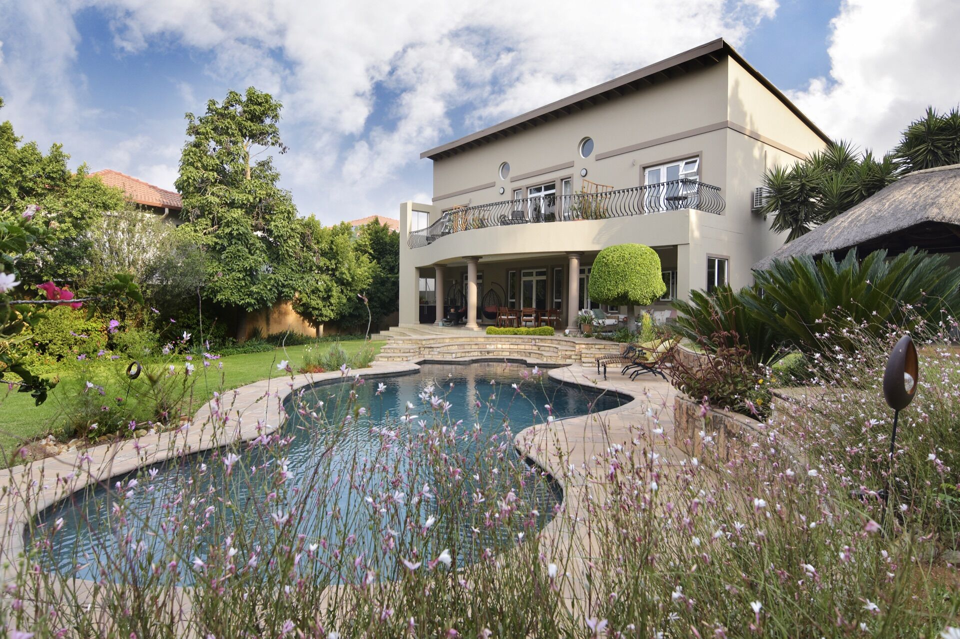 Sandown Guest House garden, pool terrace and house